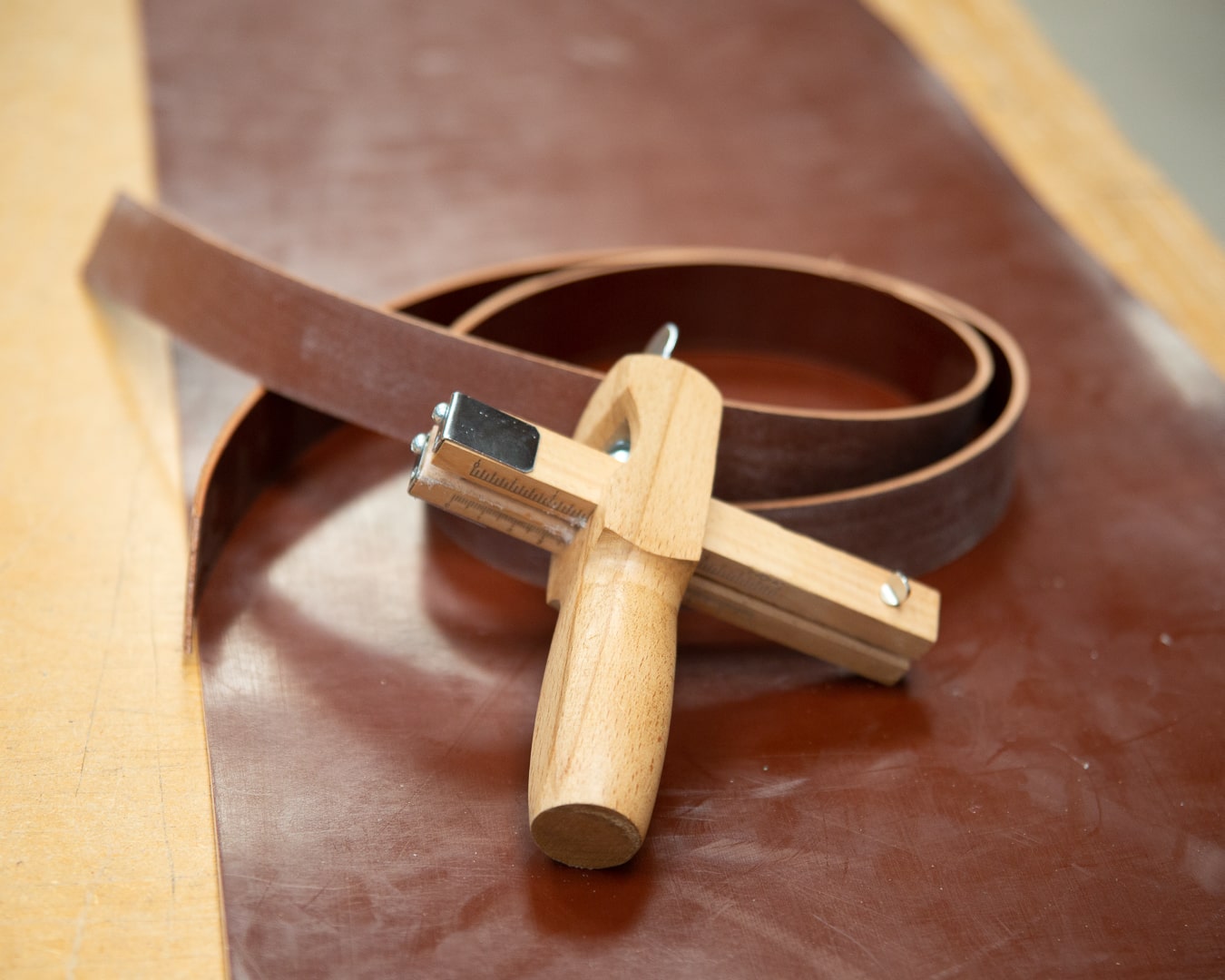 Strap cutter with leather strap