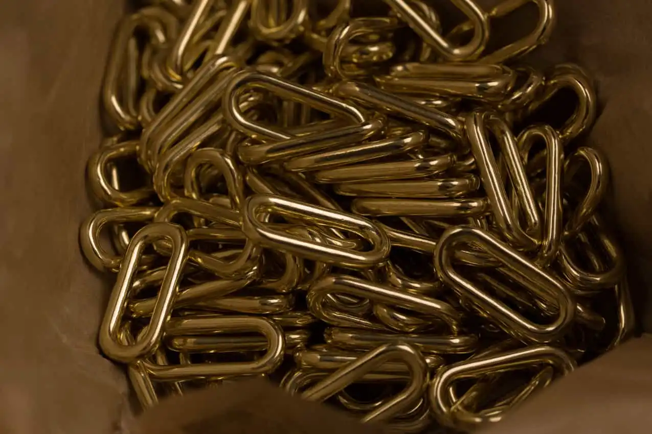 Solid brass loops in brown paper, hardware supplier